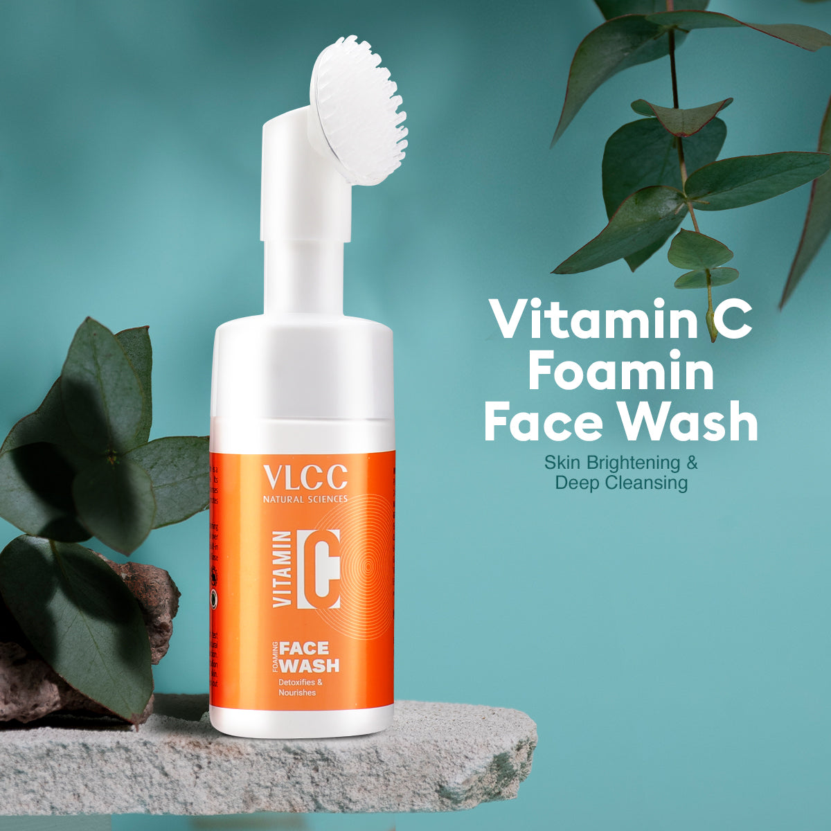 VLCC Vitamin C Foamin Face Wash with green leaves on a blue background